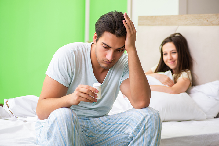 Man using pills for erection